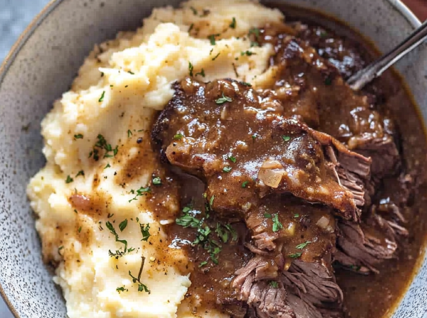 meat and gravy over mashed potatoes